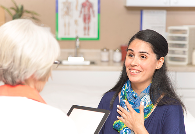 woman talking to doctor