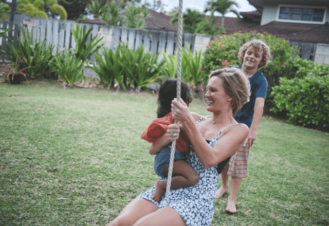 heart and vascular institute - image of Gina on swing with her children