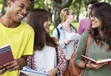 Diverse group of teens with school books