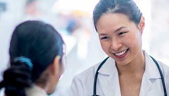 A doctor speaks to a patient.