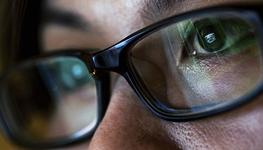 reflection in woman's glasses