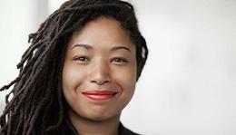 Smiling woman at her desk.