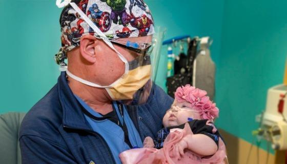 Dr. Jason Smithers holding baby Saylor