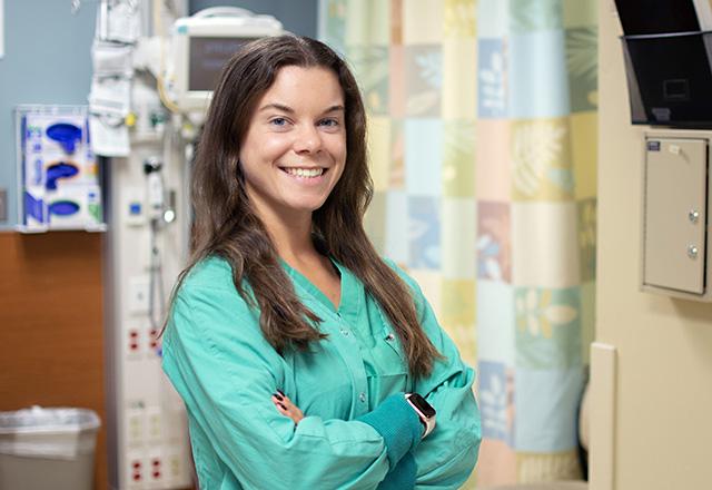 A doctor smiling at the camera