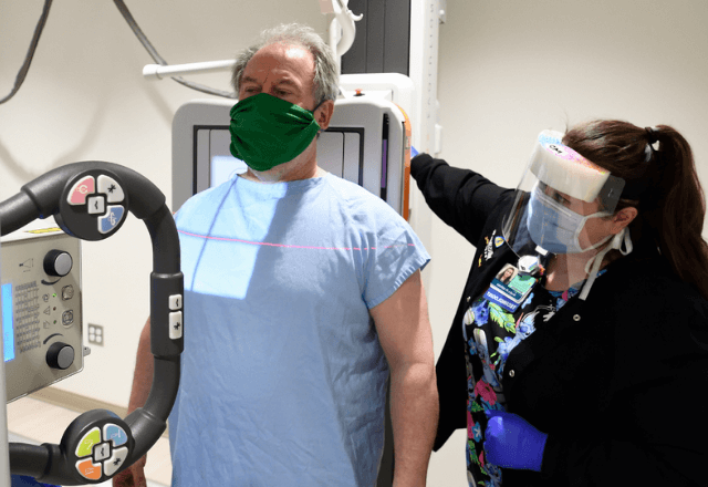 woman talking with technologist prior to her mammogram