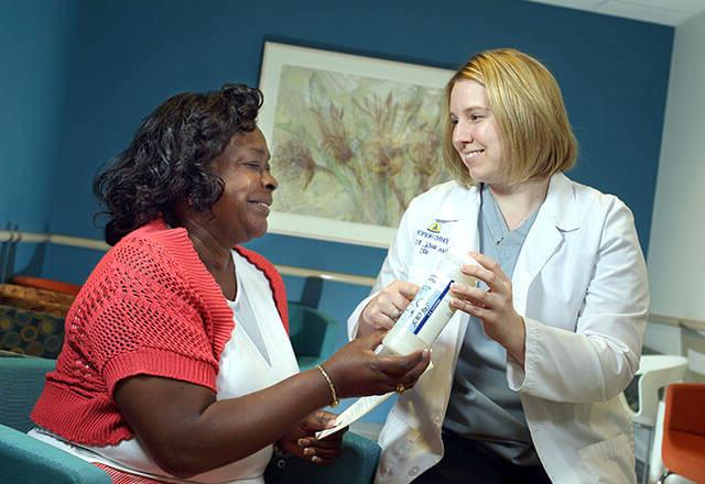 woman with doctor in waiting room