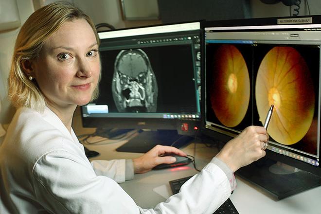 Dr. Tim McCulley looking at eye scans on computer